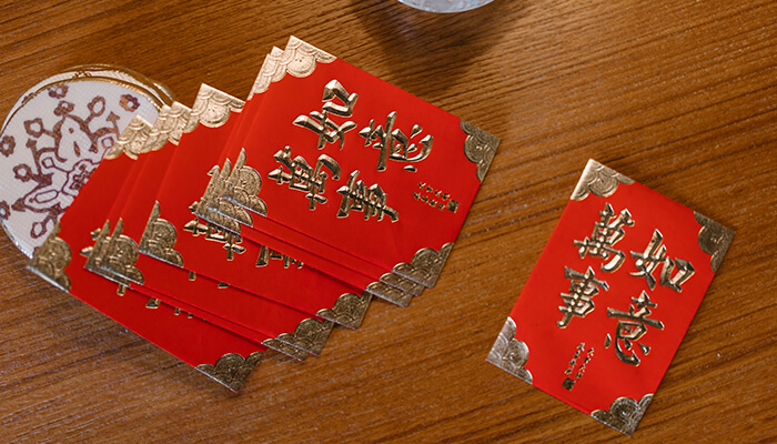 Why do people give red envelopes for Lunar New Year? - MoneySense